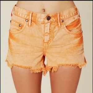 Orange/peach distressed denim shorts