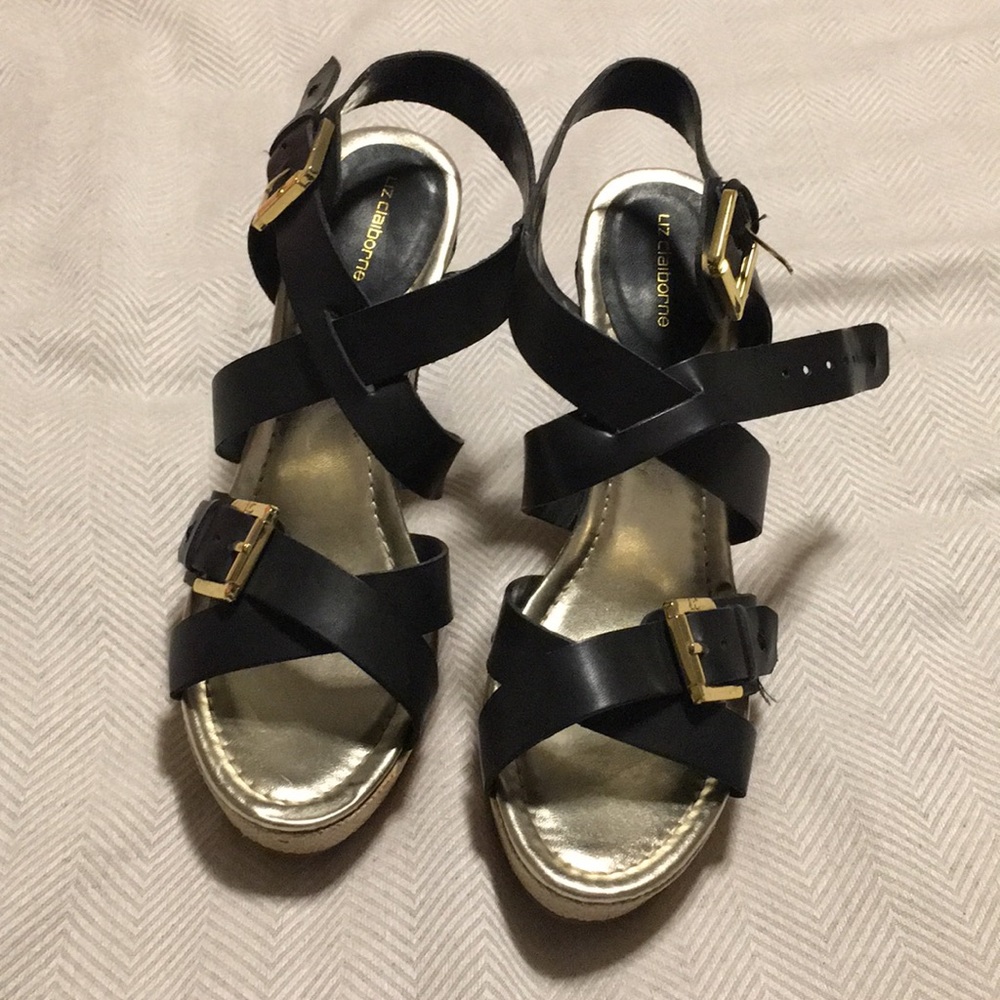 wedges with black straps and gold buckles
