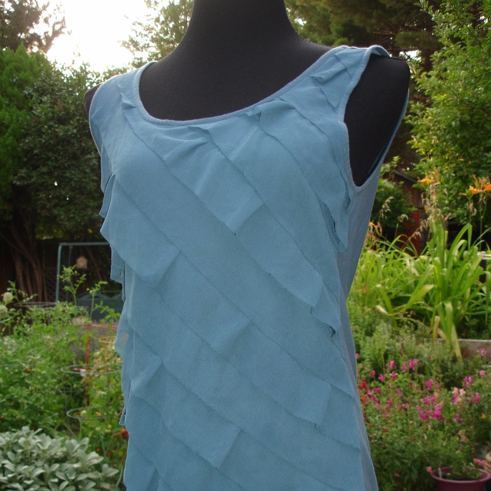 Sleeveless top with diagonal ruffles