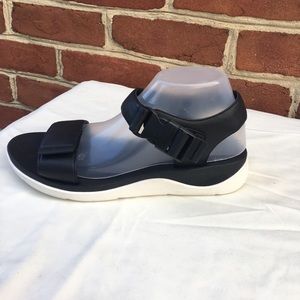 Black, leather Clark’s sandals