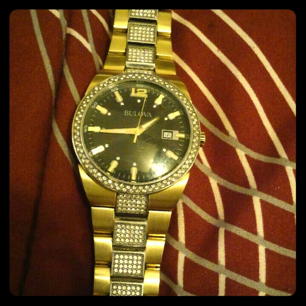A gold and diamond Bulova watch