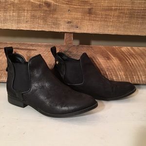 Black ankle booties with gold detail