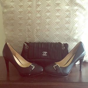 Black Cole Haan heels with silver tone buckle