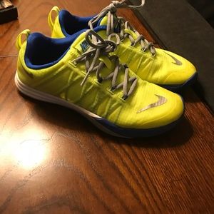 Blue and yellow Nike tennis shoes.