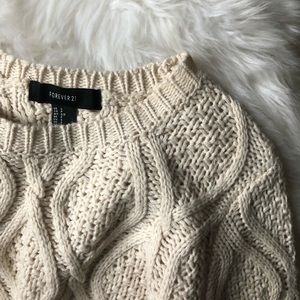 Cream cable-knit sweater