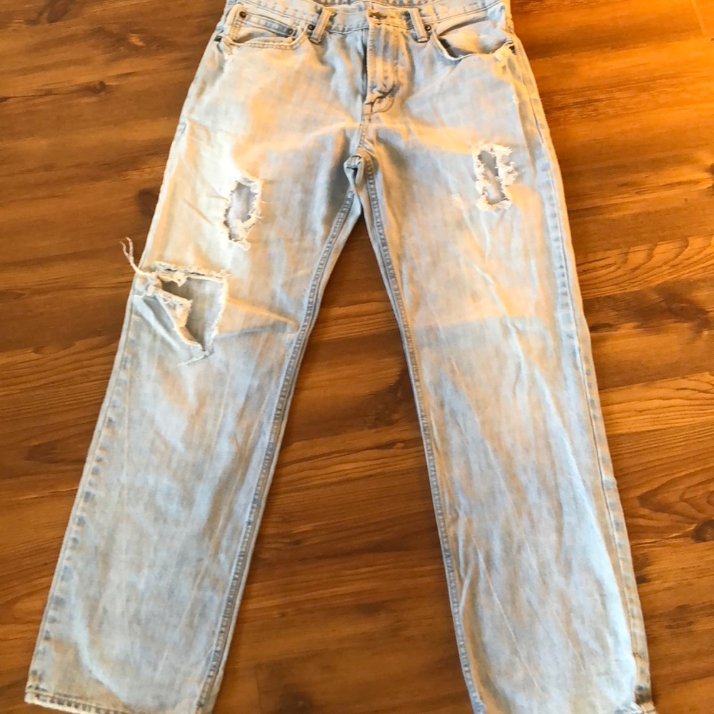 Distressed and very worn, cool jeans