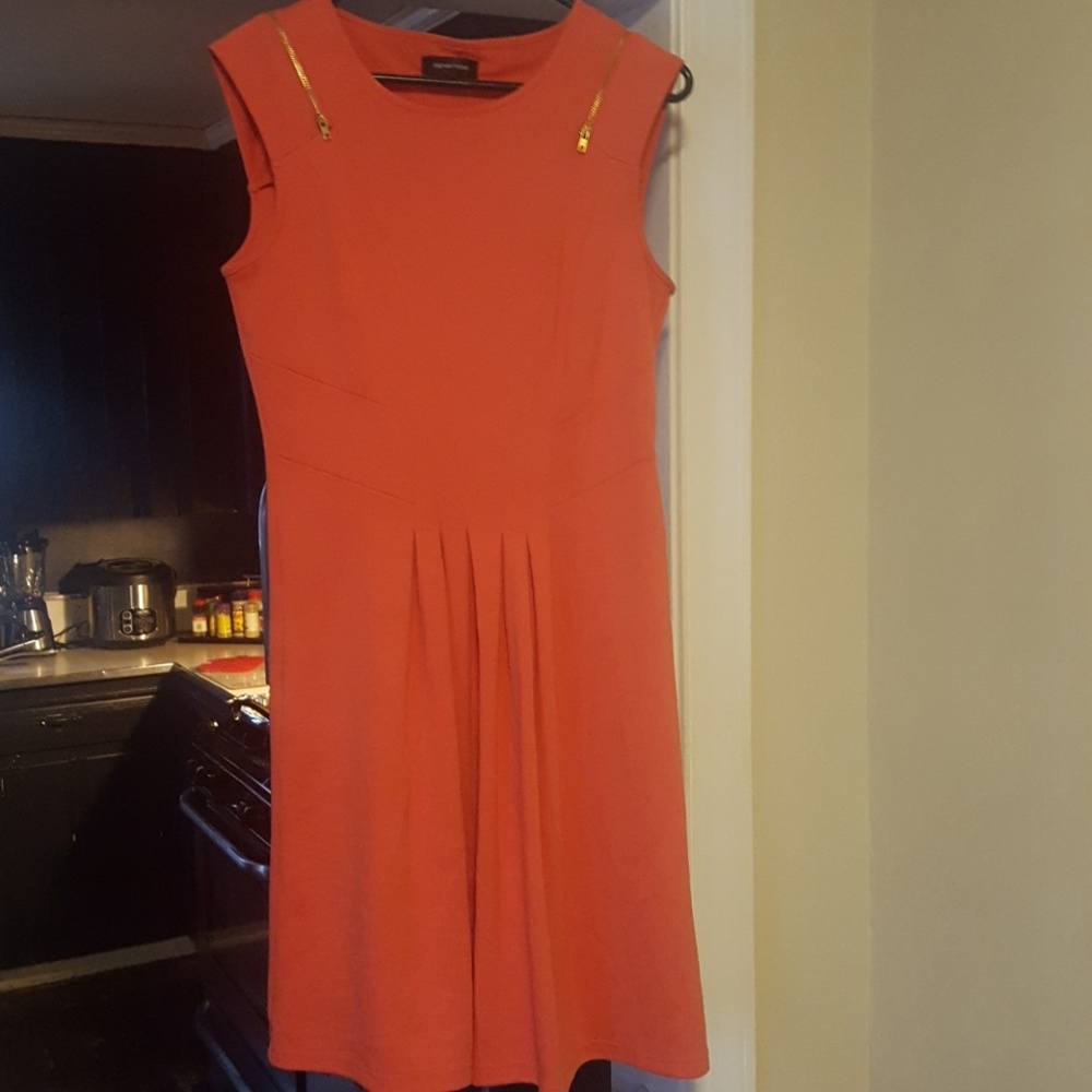 Peach colored dress with gold detail