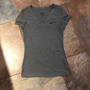 I️ am selling a grey, women’s NIKE v-neck.