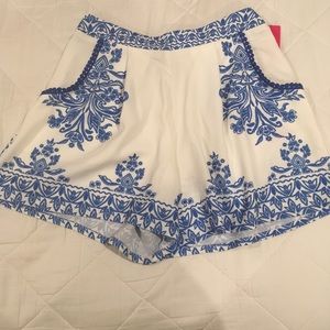 White with blue flowery/pattern detailed shorts