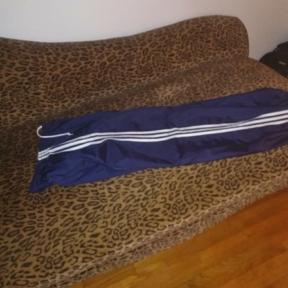 Navy blue and white Adidas sweatpants
