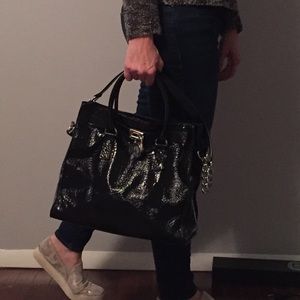 Michael Kors black patent handbag.