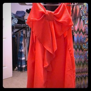 Hot orange top with bow back boutique worn once