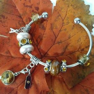 November silver plated charm bracelet