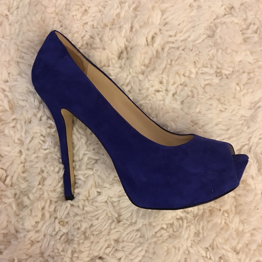 Enzo Angiolini royal blue platform peep-toe pumps.