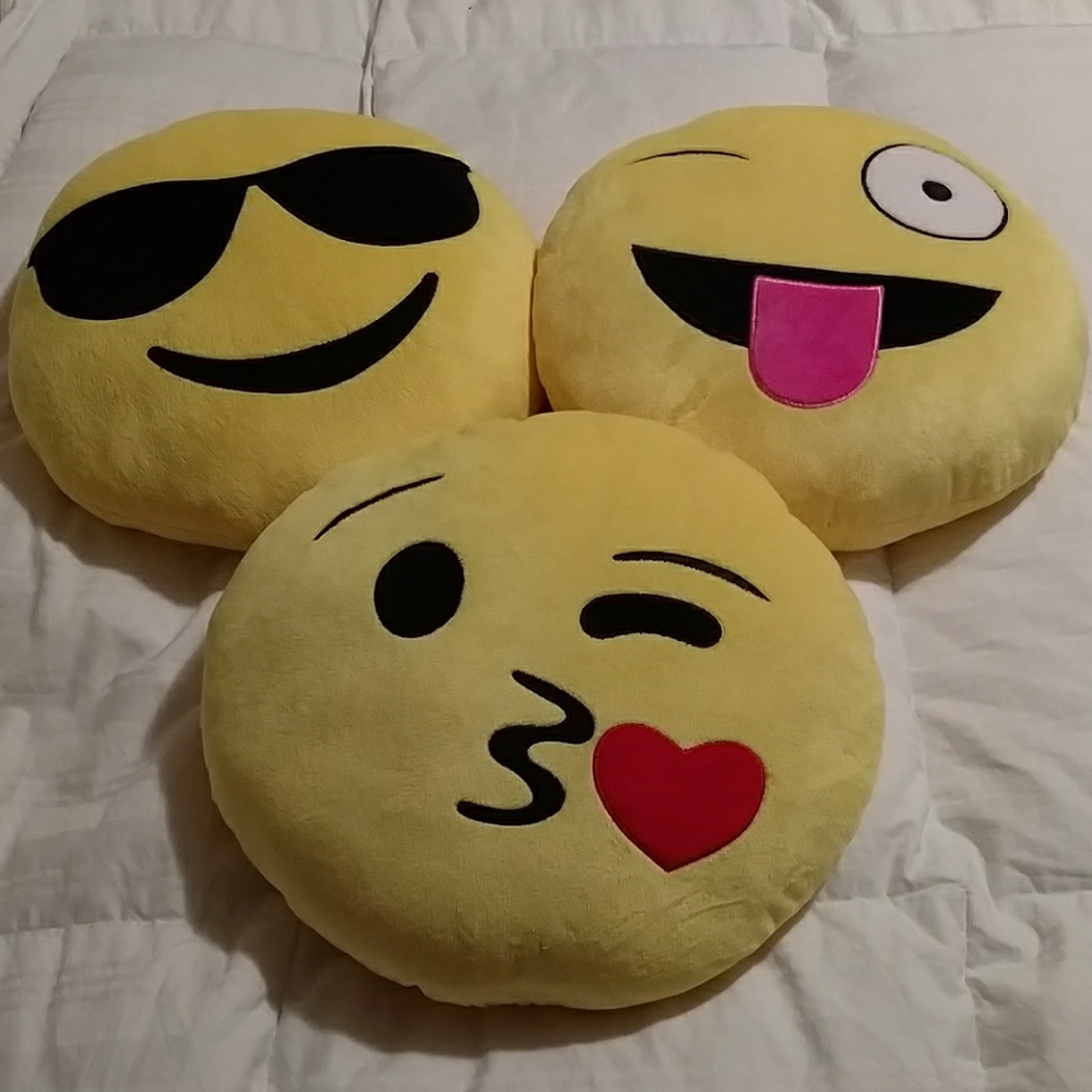 Three emoji pillows
