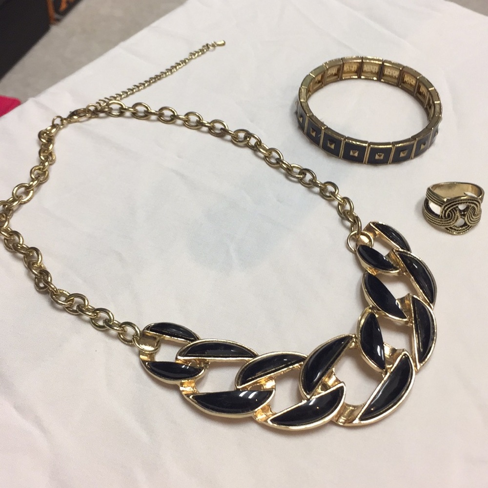 A set of black and gold colored jewelry