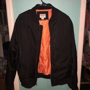 Black bomber with orange lining