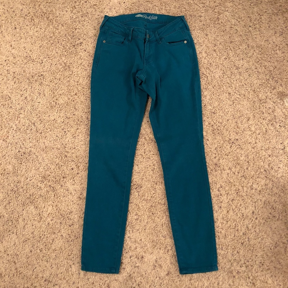 Teal colored Rockstar stretch skinny jeans
