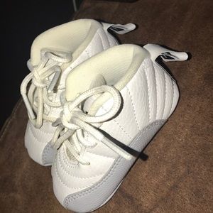 White & grey Jordan 12s