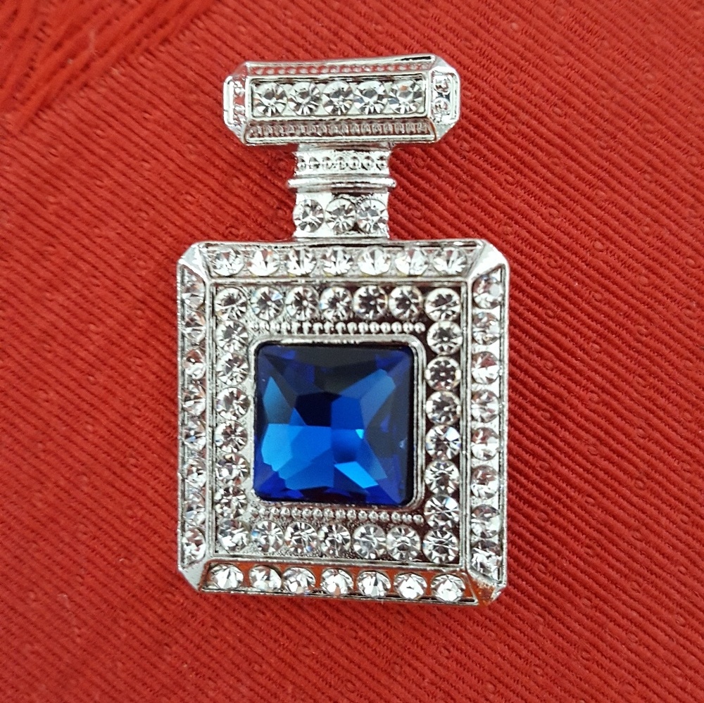 Beautiful blue stone and crystal bottle pin.