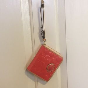 Coral Coach patent leather wallet/wristlet