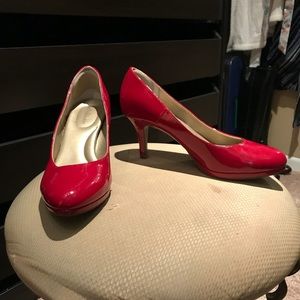 Red patent leather pumps