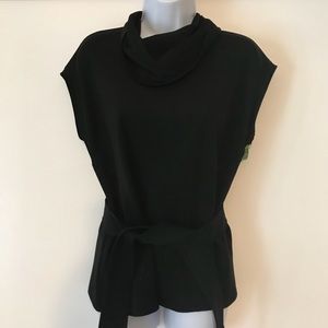 Black cowl neck top with belt.