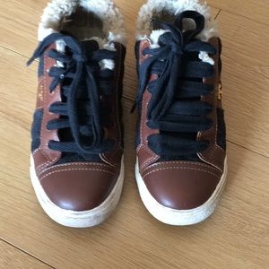 Tory burch shearling sneakers.