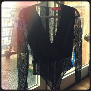 Brand new Akira sheer super low cut body suit
