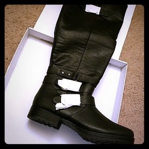 Black buckled knee high boots