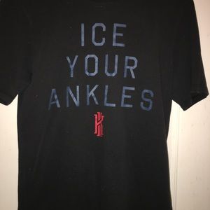 Kyrie Irving short sleeve shirt.
