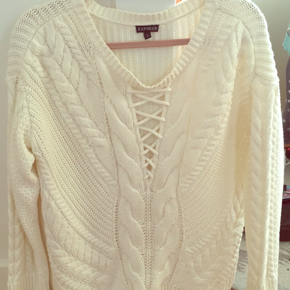 Cream sweater with criss cross detail