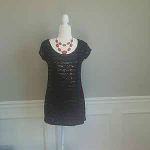 Black shimmery dress. Could be used as a shirt.