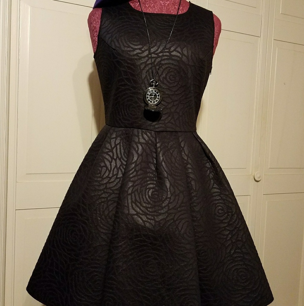Black dress with raised rose pattern NWOT.