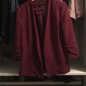 Burgundy blazer. No button closure