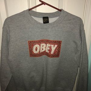 A grey obey sweater