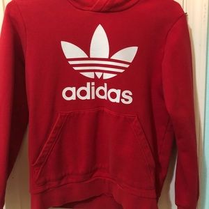 A red Adidas hoodie