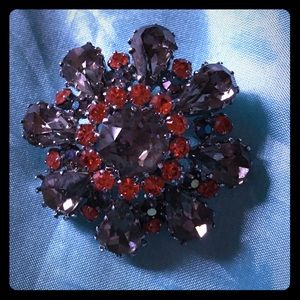 Lovely floral shaped multi stoned brooch. Austria