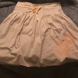 Tan skirt with orange and yellow ribbon