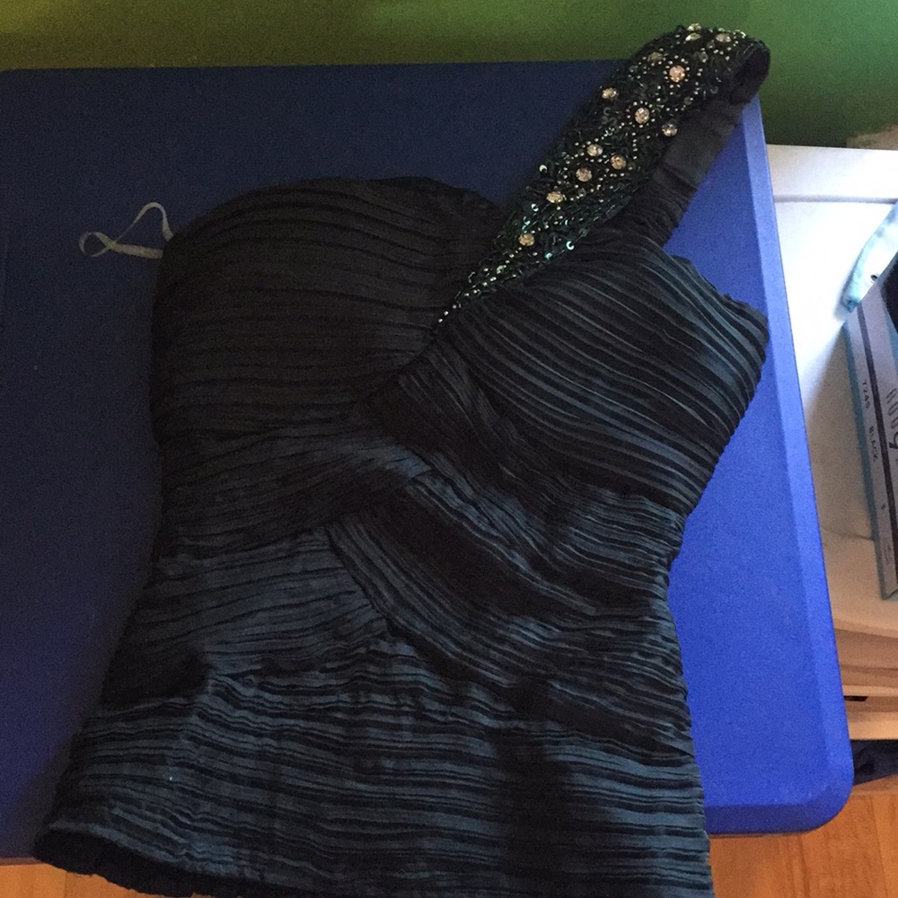 Emerald green one shoulder blouse.