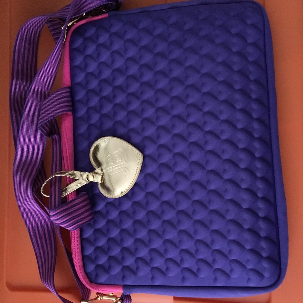 Justin Bieber pink and purple computer carrier