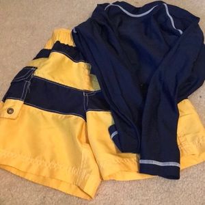 swim trunks and long sleeve rash guard
