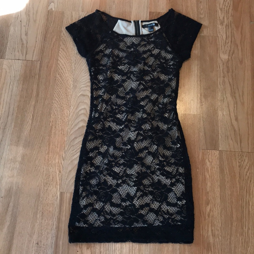 Nude and black lace body con dress