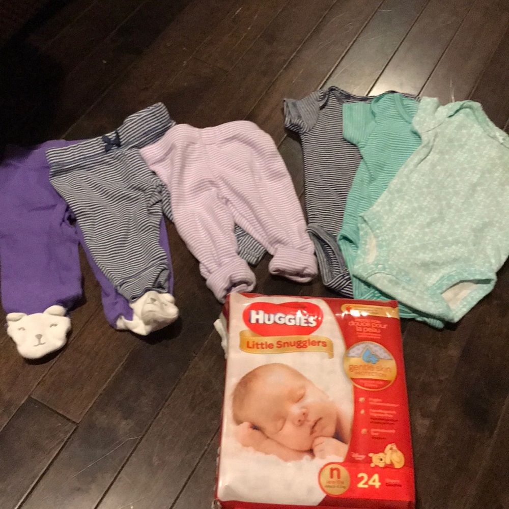 Lot of newborn clothes and 24 pack of NB diapers