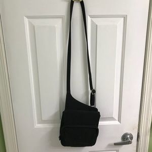 Black cross body bag with an adjustable strap