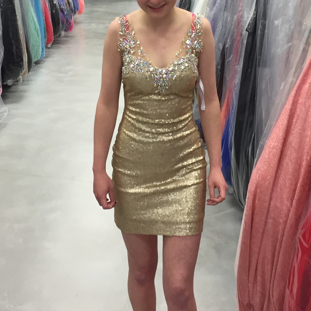 A beautiful, short prom dress worn one time
