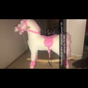 Pink and white riding horse . Never played with
