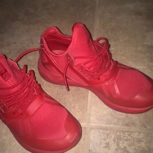All red adidas Tubular