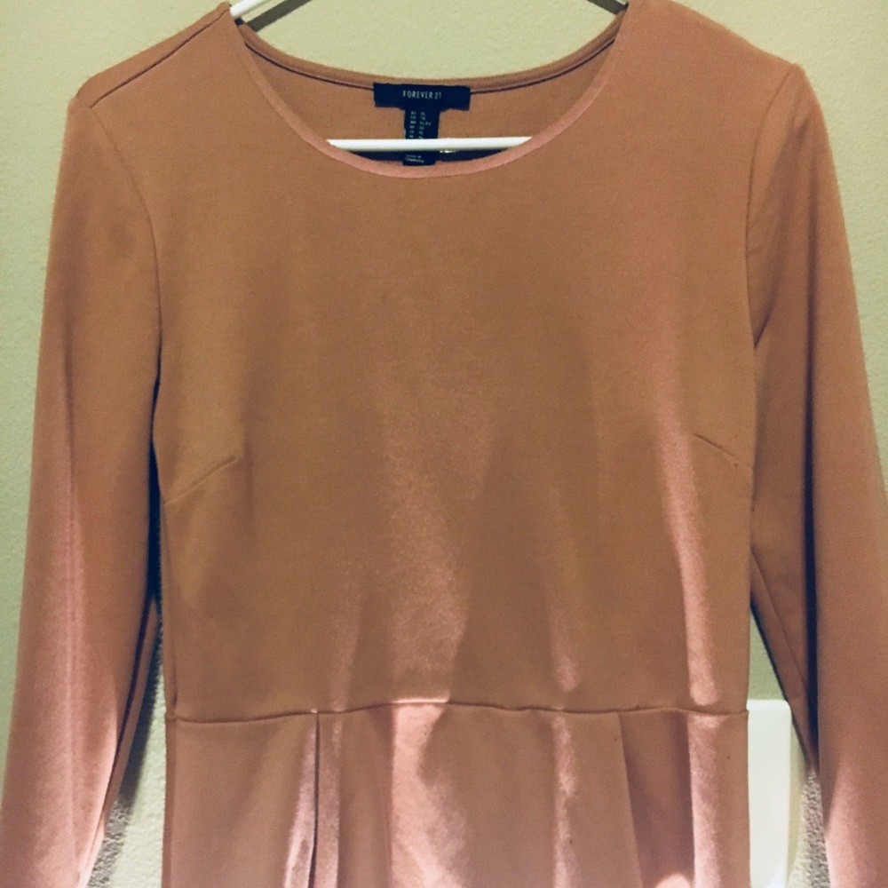 Blush colored peplum style top