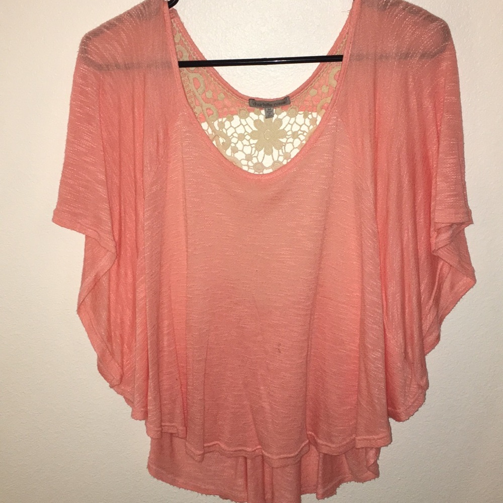 A coral/peach blouse